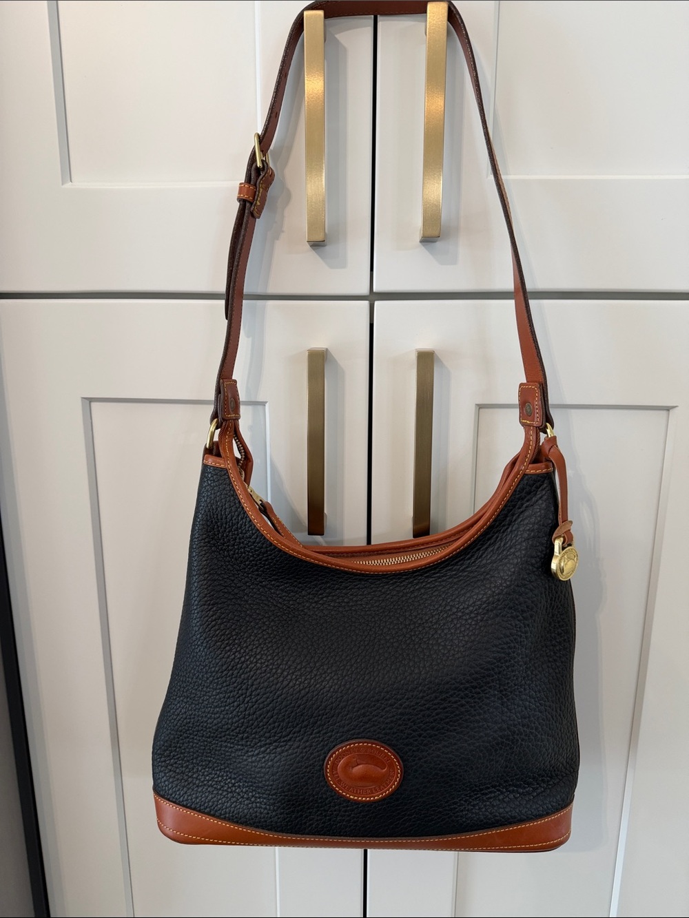 Dooney & Bourke Black Pebbled Leather Shoulder Bag with Brown Trim